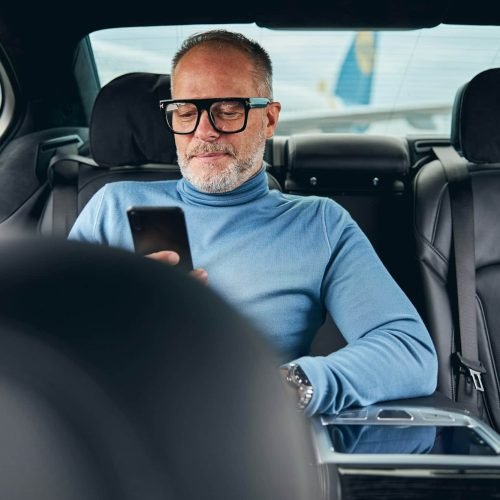 Taxi passenger sitting in the back seat